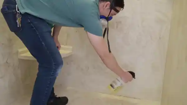 Clean Mildew from the Marble Shower with a Commercial Cleaner