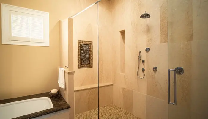 Travertine shower with mold stains