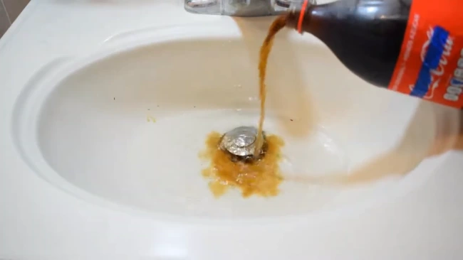 How long does it take for Coke to unclog a drain