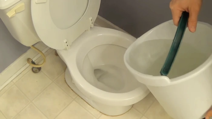 how to drain water from toilet bowl for cleaning