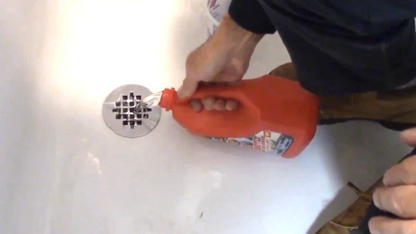 Can I put Drano in a shower drain with standing water