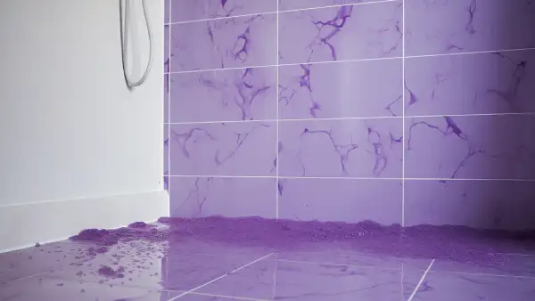 Can a magic eraser effectively remove purple shampoo stains from a shower