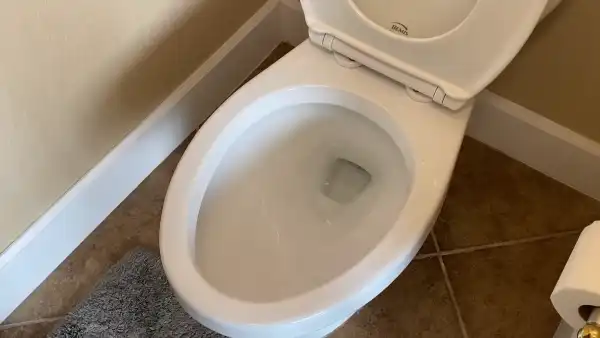 How do I make my toilet water clear