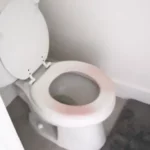 why is my toilet seat turning pink